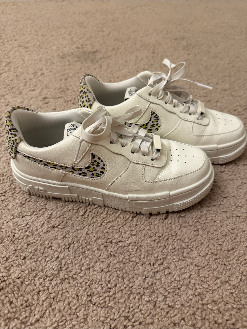 Nike Cream Sneakers with Leopard-Pattern Swoosh and Heel